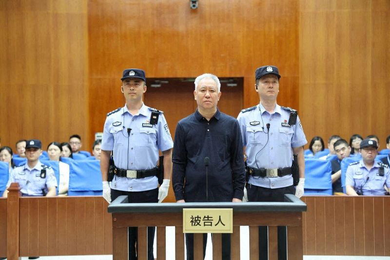 Hui Ka Yan, the founder of China's Evergrande Group stands in court at the Shenzhen Intermediate People's Court, in Shenzhen, Guangdong province, China in this handout image release by Shenzhen Intermediate People's Court on August 20, 2026. Shenzhen Intermediate People's Court/Handout via REUTERS