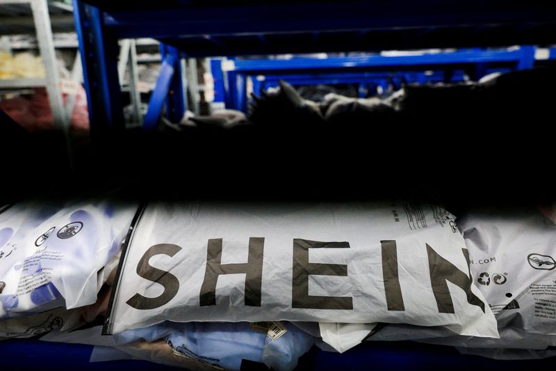 FILE PHOTO: Packs of clothing are displayed at a garment factory for Shein in Panyu District, Guangzhou, Guangdong province, China, July 27, 2026. REUTERS/Go Nakamura/File Photo