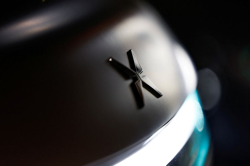 FILE PHOTO: A sign of Xpeng is seen on Xpeng's new flagship SUV GX, after a launch event for the car, in Beijing, China May 20, 2026. REUTERS/Tingshu Wang/File Photo