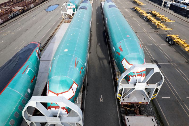 FILE PHOTO: A drone view shows Boeing 737 MAX fuselages atop rail cars at a train yard in Seattle, Washington, U.S., December 5, 2024. REUTERS/Matt Mills McKnight/File Photo