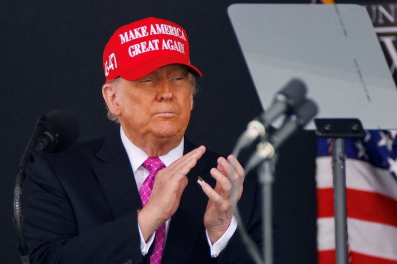 FILE PHOTO: U.S. President Donald Trump wears a 'Make America Great Again' (MAGA) hat as he attends the commencement ceremony at West Point Military Academy in West Point, New York, U.S., May 24, 2025. REUTERS/Eduardo Munoz/File Photo