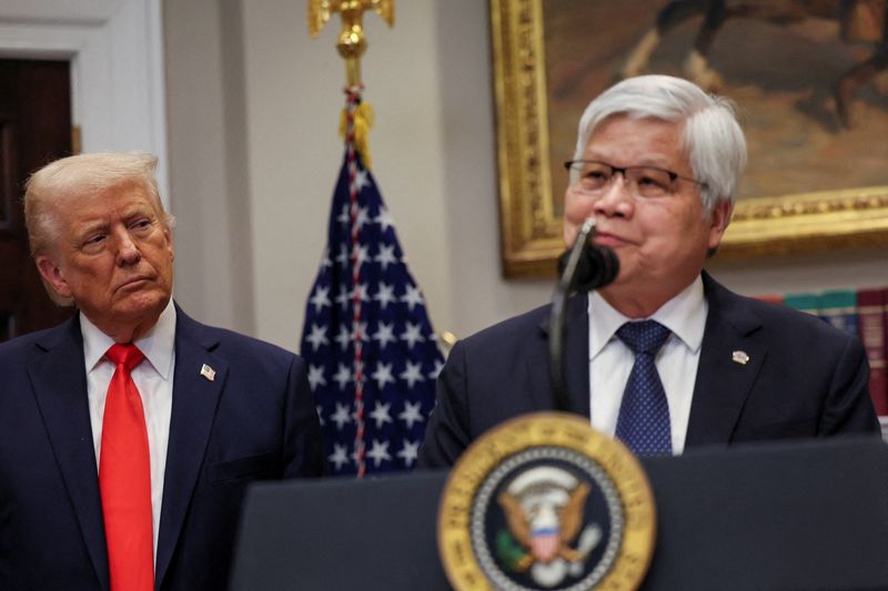FILE PHOTO: U.S. President Donald Trump listens to C.C. Wei, Chairman and CEO of TSMC, as they make an announcement about an investment from Taiwan Semiconductor Manufacturing Company (TSMC), in the Roosevelt Room at the White House in Washington, D.C., U.S., March 3, 2025. REUTERS/Leah Millis/File Photo