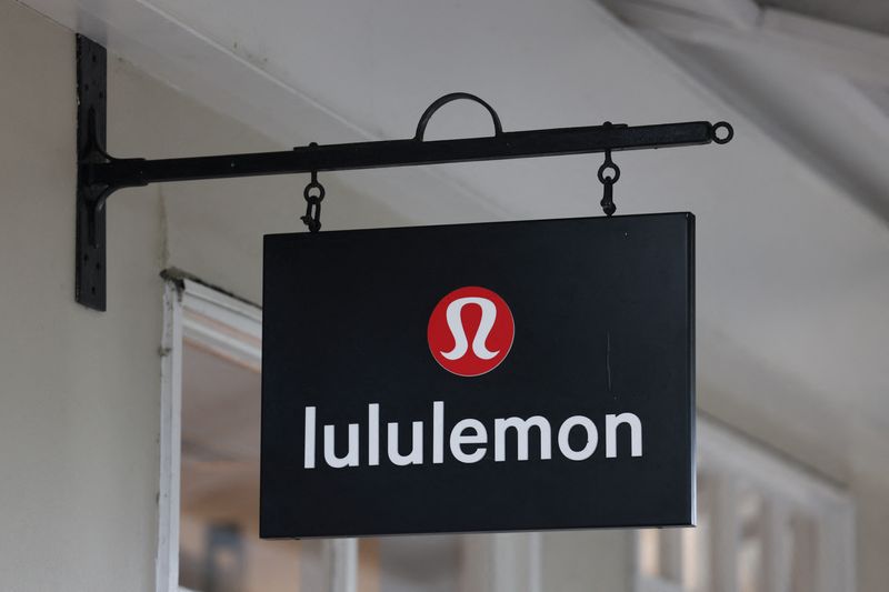 FILE PHOTO: A logo is displayed above a Lululemon outlet retail store at Bicester Village in Oxfordshire, Britain, August 21, 2024. REUTERS/Hollie Adams/File Photo