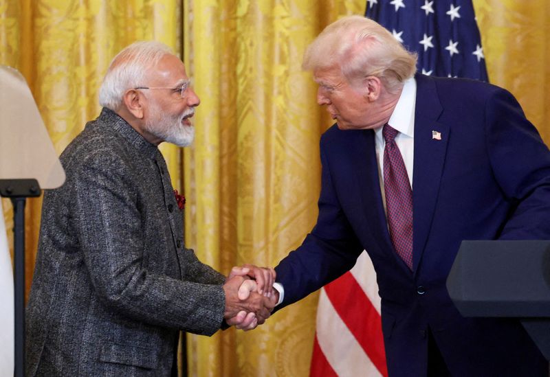 FILE PHOTO: U.S. President Donald Trump and Indian Prime Minister Narendra Modi shake hands as they attend a joint press conference at the White House in Washington, D.C., U.S., February 13, 2025. REUTERS/Kevin Lamarque/File Photo/File Photo