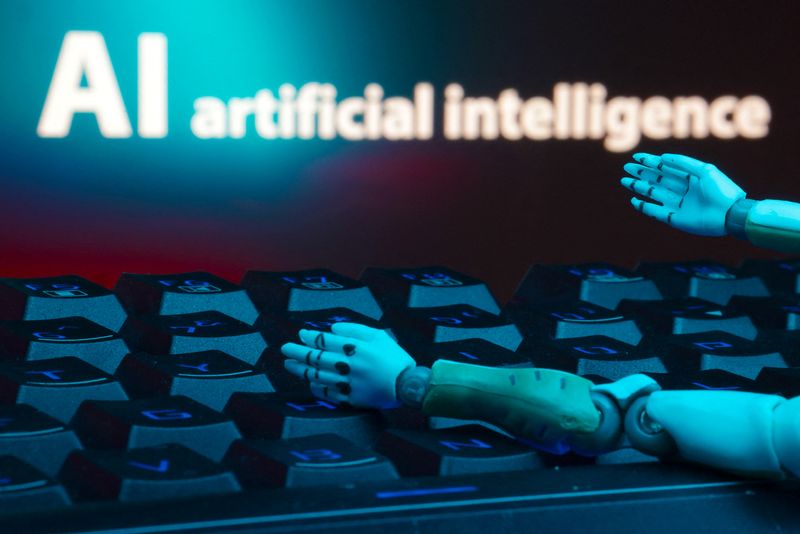 A message reading "AI artificial intelligence", a keyboard, and robot hands are seen in this illustration taken January 27, 2025. REUTERS/Dado Ruvic/Illustration/ File Photo