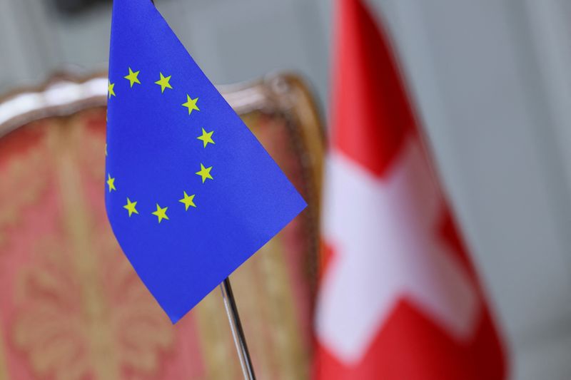 FILE PHOTO: Swiss and European Union flags hang at the Lohn Estate in Kehrsatz near Bern, Switzerland, November 27, 2024. REUTERS/Denis Balibouse/File Photo