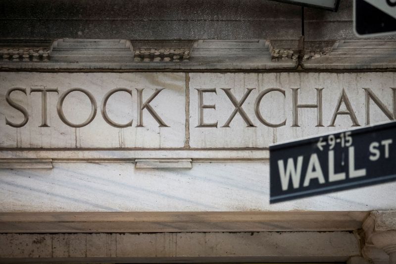 FILE PHOTO: The Wall Street entrance to the New York Stock Exchange (NYSE) is seen in New York City, U.S., November 15, 2022. REUTERS/Brendan McDermid/File Photo