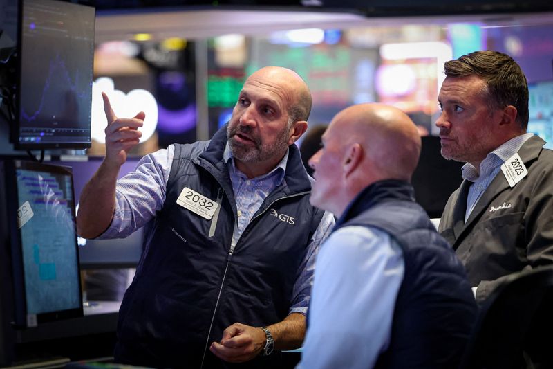 Specialist traders work inside a booth on the floor at the New York Stock Exchange (NYSE) in New York City, U.S., September 10, 2025.  REUTERS/Brendan McDermid