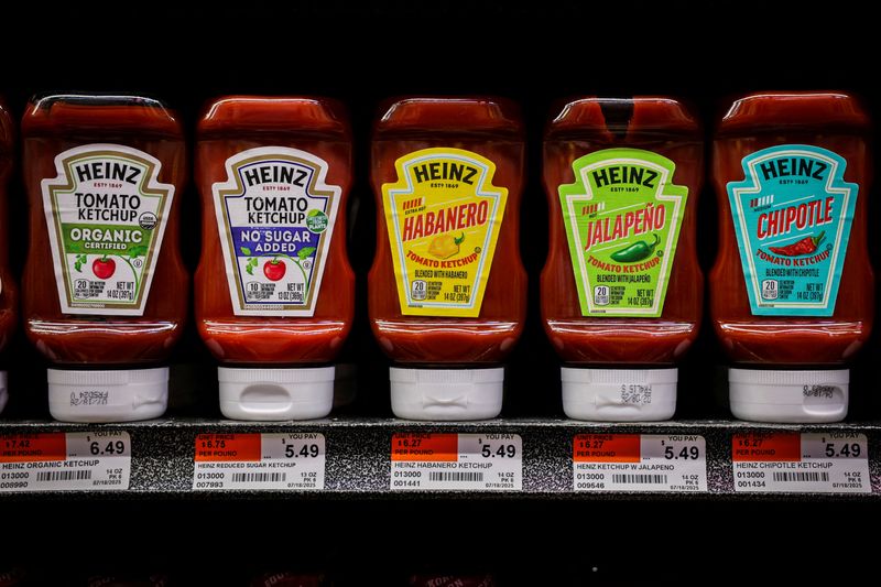 FILE PHOTO: Heinz Ketchup products sit on a supermarket shelf in New York City, U.S., August 22, 2025, after Kraft Heinz (KHC.O) announced it would split its grocery and sauces businesses into two publicly traded companies. REUTERS/Jeenah Moon/File Photo