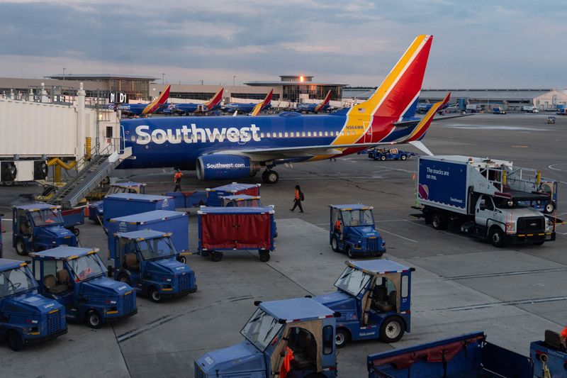Southwest Airlines planes and vehicles sit on the tarmac at Nashville International Airport in Nashville, Tennessee, U.S., July 30, 2025. REUTERS/Kylie Cooper/File Photo