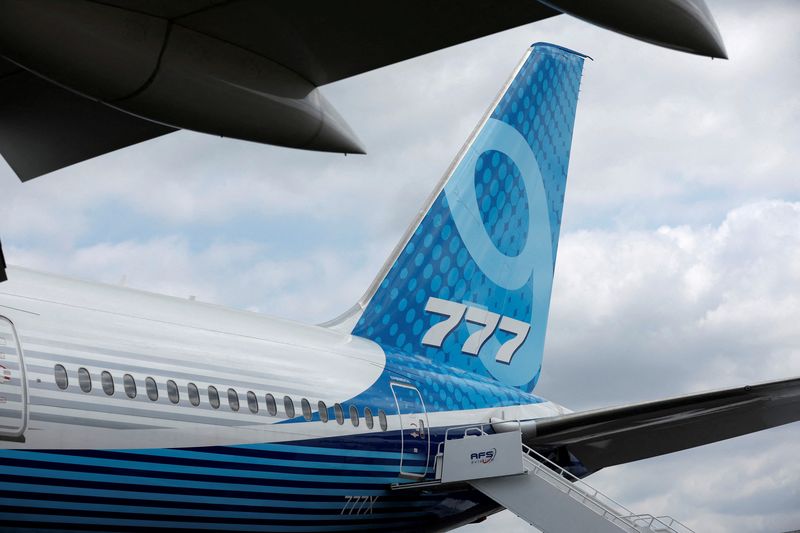 FILE PHOTO: The tail of a Boeing 777X is displayed at the Farnborough International Airshow, in Farnborough, Britain, July 20, 2022.  REUTERS/Peter Cziborra/File Photo