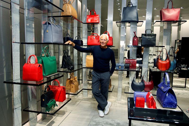 FILE PHOTO: Italian designer Giorgio Armani poses for pictures inside his boutique in Via Condotti, in Rome, Italy, June 5, 2013. REUTERS/Remo Casilli/File Photo