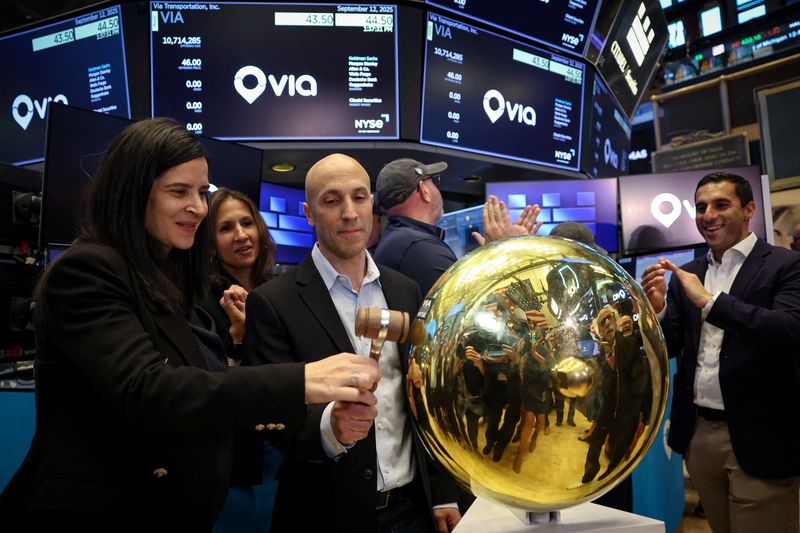 Daniel Ramot, CEO Co-Founder of Via Transportation, Inc. and Clara Fain, CFO of Via Transportation, Inc., ring a ceremonial bell as the stock begins to trade during the company's IPO at the New York Stock Exchange (NYSE) in New York City, U.S., September 12, 2025.  REUTERS/Brendan McDermid