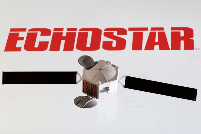 FILE PHOTO: A satellite model is placed on EchoStar Satellite Services logo in this picture illustration taken April 4, 2022. REUTERS/Dado Ruvic/Illustration/File Photo