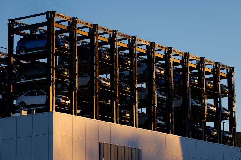 FILE PHOTO: An automobile dealership uses racks to store its inventory of vehicles in Los Angeles, California, U.S. January 29, 2024.  REUTERS/Mike Blake/File Photo