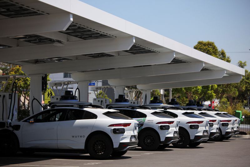 FILE PHOTO: Waymo driverless vehicles charge at a Waymo charging station in Santa Monica, California, U.S., May 30, 2025. REUTERS/Daniel Cole/File Photo