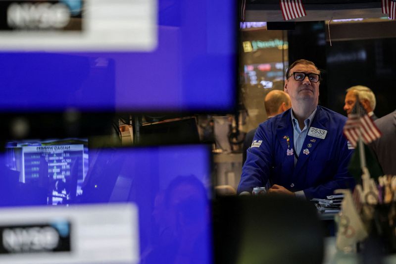 A trader works on the floor at the New York Stock Exchange (NYSE) in New York City, U.S., July 8, 2025. REUTERS/Jeenah Moon/ File Photo