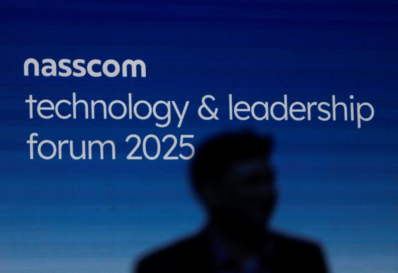 FILE PHOTO: A man walks during the Nasscom Technology and Leadership Forum 2025 in Mumbai, India February 25, 2025. REUTERS/Francis Mascarenhas/File Photo