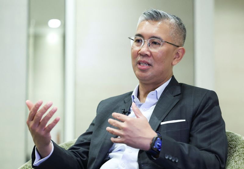 FILE PHOTO: Malaysia's Trade Minister Tengku Zafrul Aziz speaks during an interview with Reuters at Kuala Lumpur, Malaysia March 5, 2025. REUTERS/Hasnoor Hussain/File Photo
