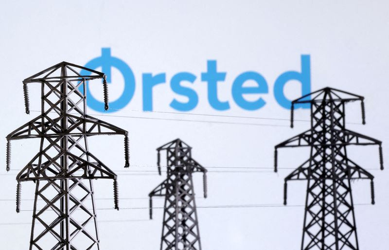 FILE PHOTO: Electric power transmission pylon miniatures and Orsted logo are seen in this illustration taken, December 9, 2022. REUTERS/Dado Ruvic/Illustration/File Photo
