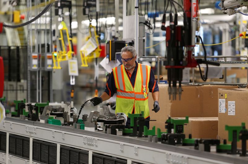 FILE PHOTO: A Volvo employee works in the final assembly building at the first U.S. production plant in Ridgeville, South Carolina, U.S., June 20, 2018. REUTERS/Randall Hill/File Photo