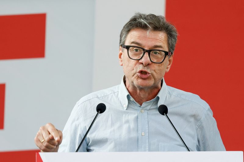 FILE PHOTO: Italian Economy Minister Giancarlo Giorgetti speaks on stage at the annual League party rally in Pontida, Italy, September 21, 2025. REUTERS/Remo Casilli/File Photo