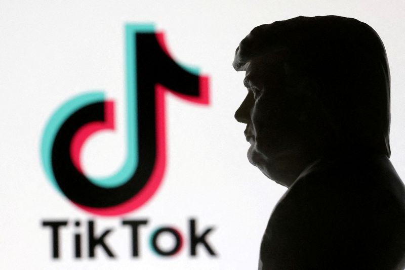 FILE PHOTO: A 3D-printed miniature model of U.S. President Donald Trump and TikTok logo are seen in this illustration created on January 15, 2025. REUTERS/Dado Ruvic/Illustration/File Photo