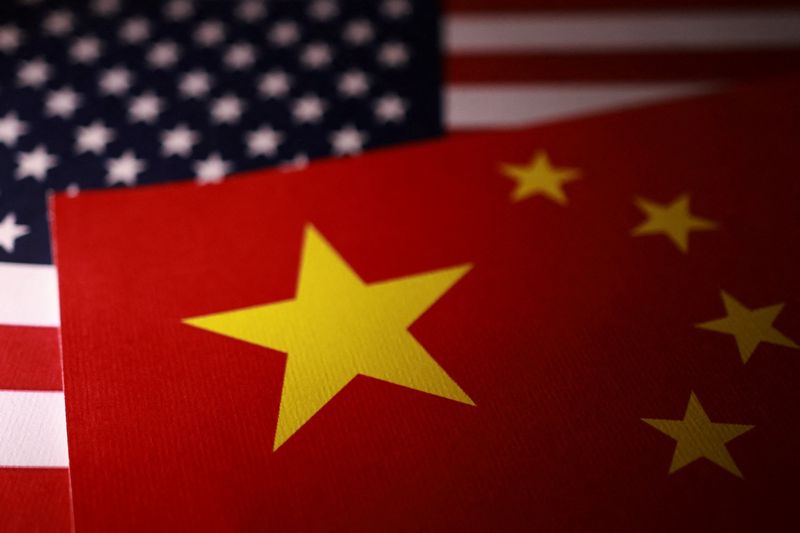 FILE PHOTO: U.S. and Chinese flags are displayed in this illustration taken September 24, 2025. REUTERS/Dado Ruvic/Illustration/File Photo