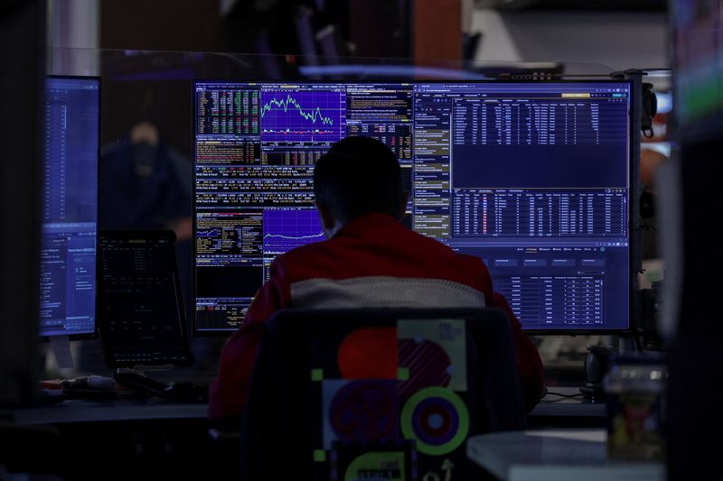 A trader works on the floor at the New York Stock Exchange (NYSE) in New York City, U.S., September 22, 2025. REUTERS/Jeenah Moon/File Photo