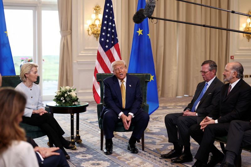 FILE PHOTO: U.S. President Donald Trump speaks, while sat with European Commission President Ursula von der Leyen, after an announcement of a trade deal between the U.S. and EU, in Turnberry, Scotland, Britain, July 27, 2025. REUTERS/Evelyn Hockstein/File Photo