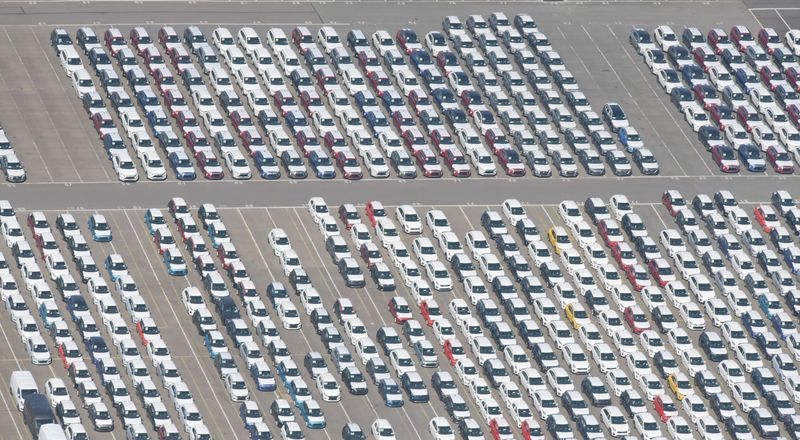 FILE PHOTO: Cars intended for export wait at the port for loading in Bremerhaven, Germany, April 24, 2020. REUTERS/Fabian Bimmer/File Photo