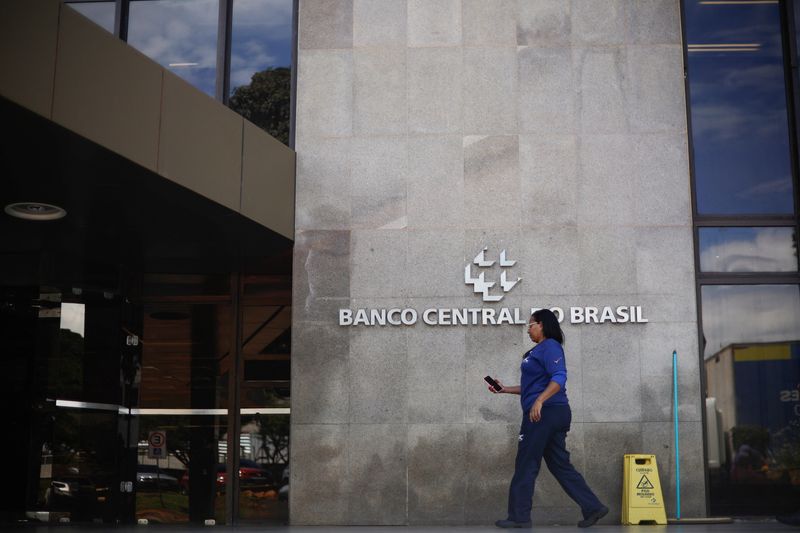 A person walks in front of the Central Bank of Brazil headquarters building in Brasilia, Brazil December 17, 2024. REUTERS/Adriano Machado