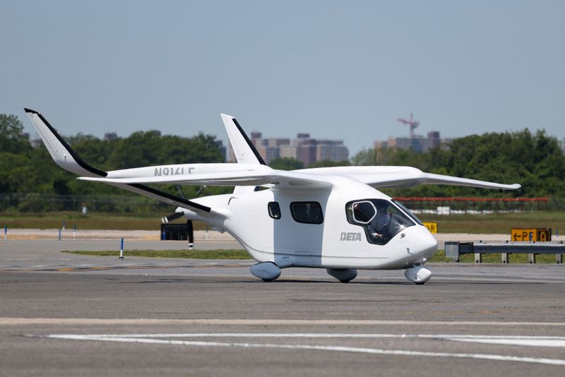 FILE PHOTO: Aerospace manufacturer BETA Technologies' electric aircraft, ALIA, taxis at John F. Kennedy Airport in New York City, U.S., June 3, 2025. REUTERS/Kylie Cooper/File Photo