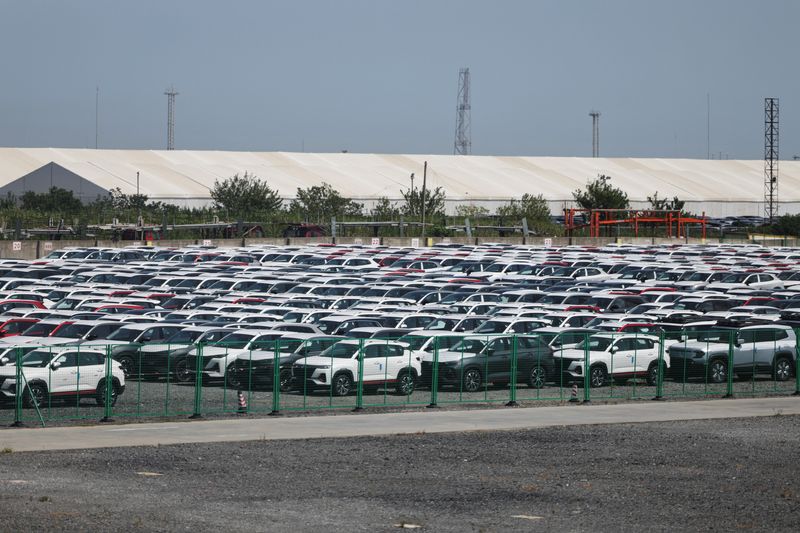 New cars are stored at a parking lot in Shanghai, China, September 8, 2025.  REUTERS/Go Nakamura