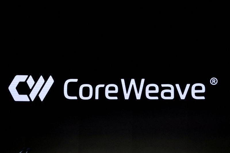 FILE PHOTO: A screen displays the company logo for CoreWeave, Inc., Nvidia-backed cloud services provider, during the company's IPO at the Nasdaq Market, in New York City, U.S., March 28, 2025. REUTERS/Brendan McDermid/File Photo