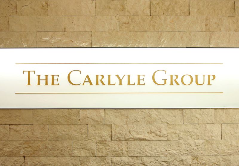 The logo of the Carlyle Group is displayed at the company's office in Tokyo, Japan October 17, 2018. REUTERS/Issei Kato