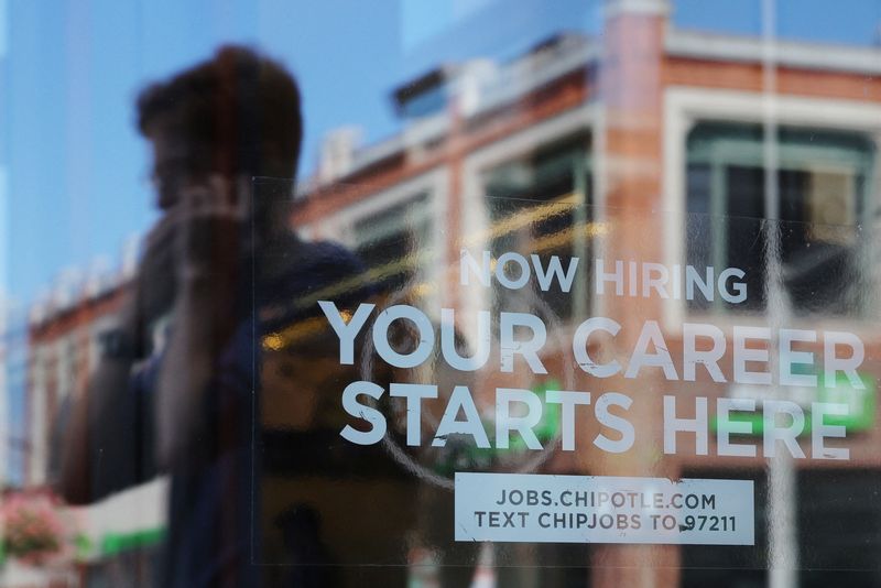 A Chipotle restaurant advertises it is hiring in Cambridge, Massachusetts, U.S., August 28, 2023. REUTERS/Brian Snyder