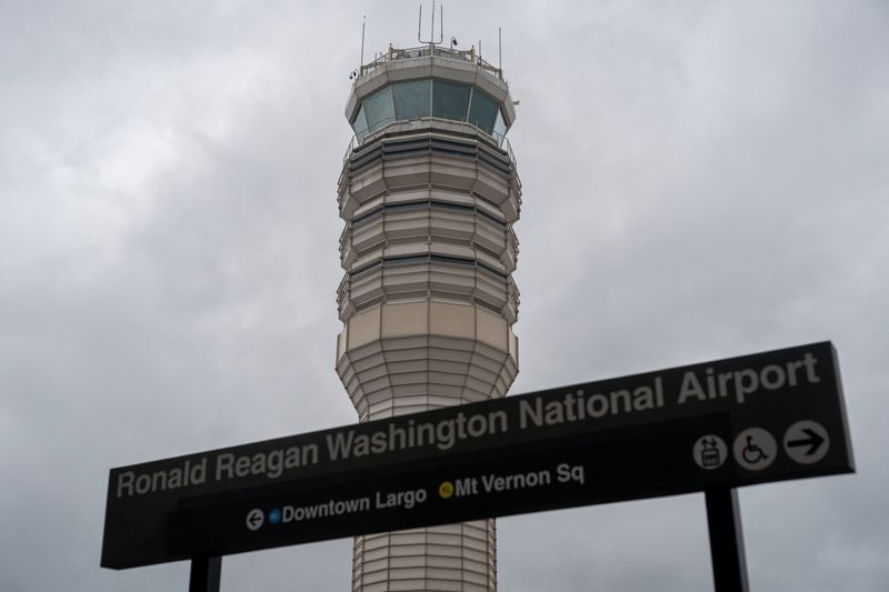 An air traffic control tower at Reagan Washington National Airport as the U.S. government shutdown continues in Arlington, Virginia, U.S., October 8, 2025. REUTERS/Nathan Howard