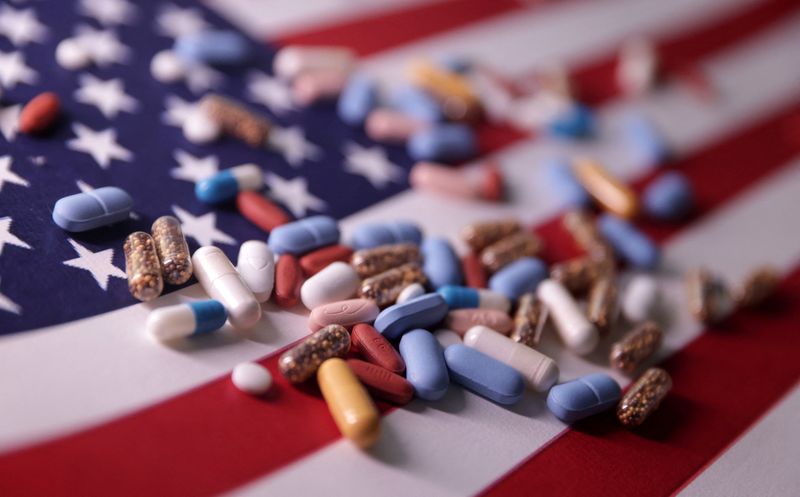 U.S. flag and medicines are seen in this illustration taken, June 27, 2024. REUTERS/Dado Ruvic/Illustration