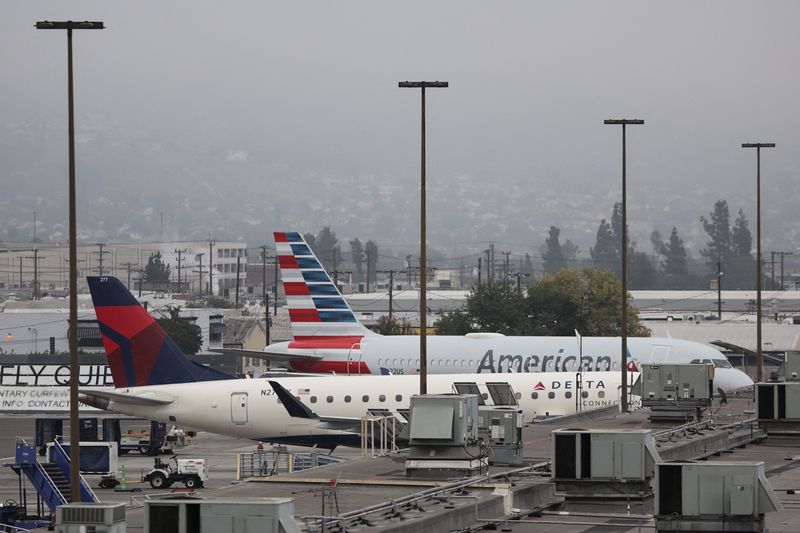 Aircrafts sit at Hollywood Burbank Airport in Burbank, California, U.S., October 7, 2025. REUTERS/Daniel Cole