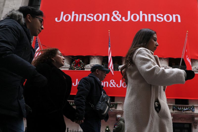 A Johnson & Johnson banner is displayed on the front of the New York Stock Exchange (NYSE) in New York City, in New York City, U.S., December 5, 2023.  REUTERS/Brendan McDermid