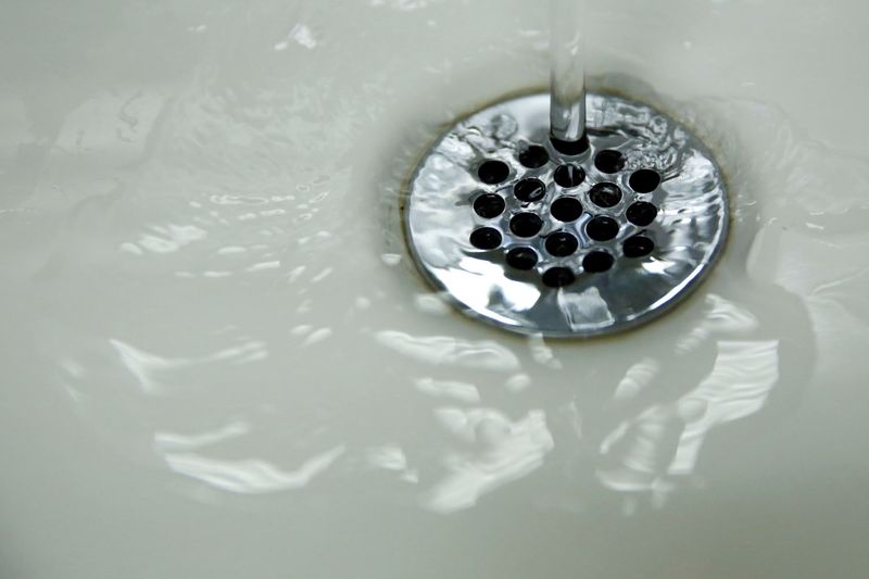 FILE PHOTO: Running tap water is seen in Flint, in Michigan, May 4, 2016. REUTERS/Carlos Barria/File Photo
