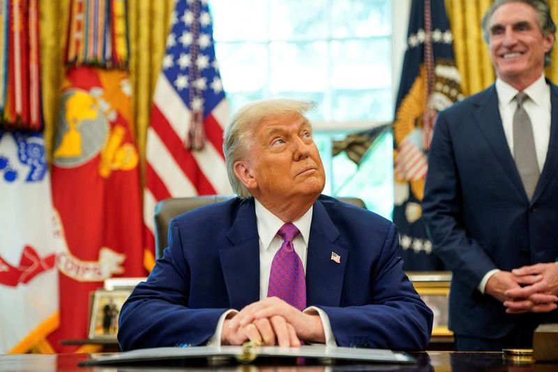 U.S. President Donald Trump sits in the Oval Office at the White House, in Washington, D.C., U.S., June 10, 2025. REUTERS/Nathan Howard