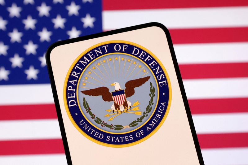 United States Department of Defense logo and U.S. flag are seen in this illustration taken April 23, 2025. REUTERS/Dado Ruvic/Illustration