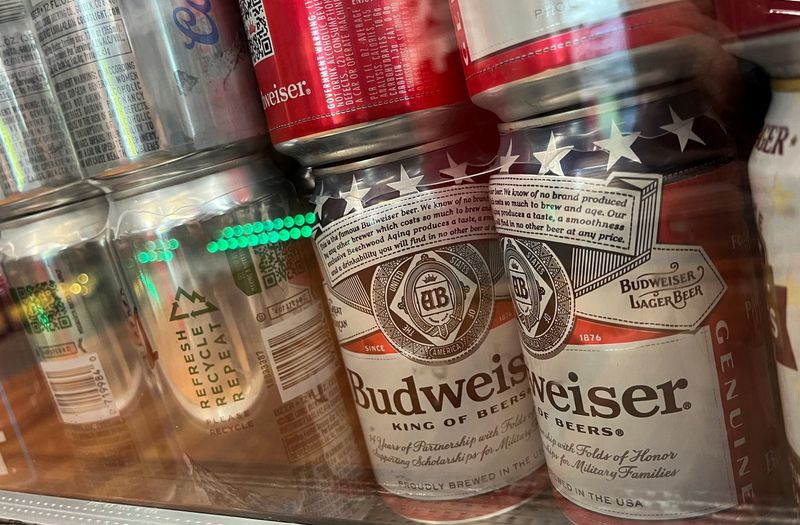 FILE PHOTO: Cans of Budweiser brand beer are pictured at a liquor store in Washington, D.C. U.S., September 1, 2024. REUTERS/Daniel Becerril/File Photo