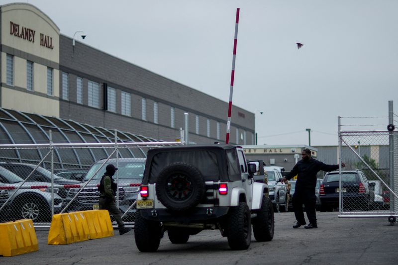 A security worker closes a gate at Delaney Hall, a 1,000-person detention center operated by private prison company GEO Group for Immigration and Customs Enforcement (ICE), in Newark, New Jersey, U.S., June 18, 2025.  REUTERS/Eduardo Munoz