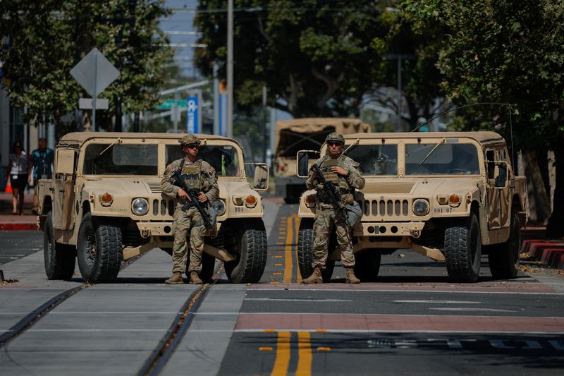 Members of the California National Guard are deployed outside a complex of federal buildings in Santa Ana, California, U.S. June, 18, 2025.  REUTERS/Mike Blake