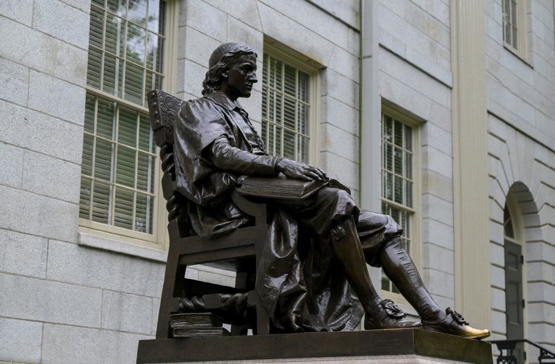 The John Harvard statue on the campus of Harvard University in Cambridge, Massachusetts, U.S., May 23, 2025.   REUTERS/Faith Ninivaggi