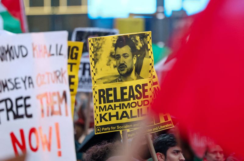 FILE PHOTO: Protesters supporting Mahmoud Khalil rally in Times Square, the day after a U.S. immigration judge ruled that Columbia student Khalil, who led pro-Palestinian student protests on campus, can be deported, in New York City, New York, U.S., April 12, 2025. REUTERS/Caitlin Ochs/File Photo