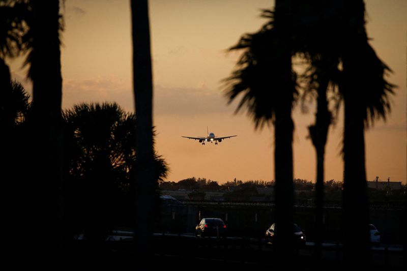 An aircraft approaches to land at Miami International Airport after the Federal Aviation Administration (FAA) said it had slowed the volume of airplane traffic over Florida due to an air traffic computer issue, in Miami, Florida, U.S. January 2, 2023.  REUTERS/Marco Bello/File Photo